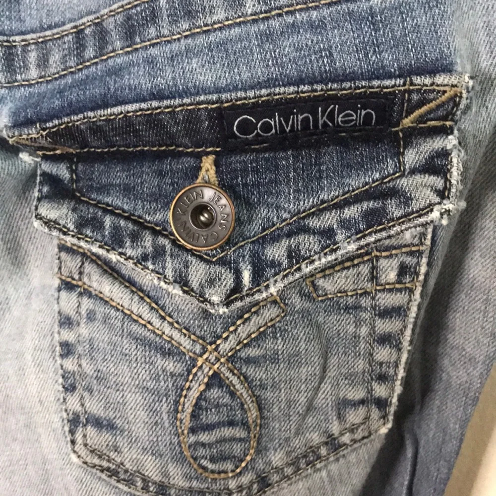Calvin Klein distressed medium dark wash jeans 10